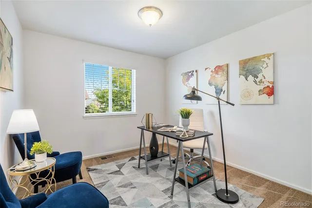 a workspace with furniture and a window