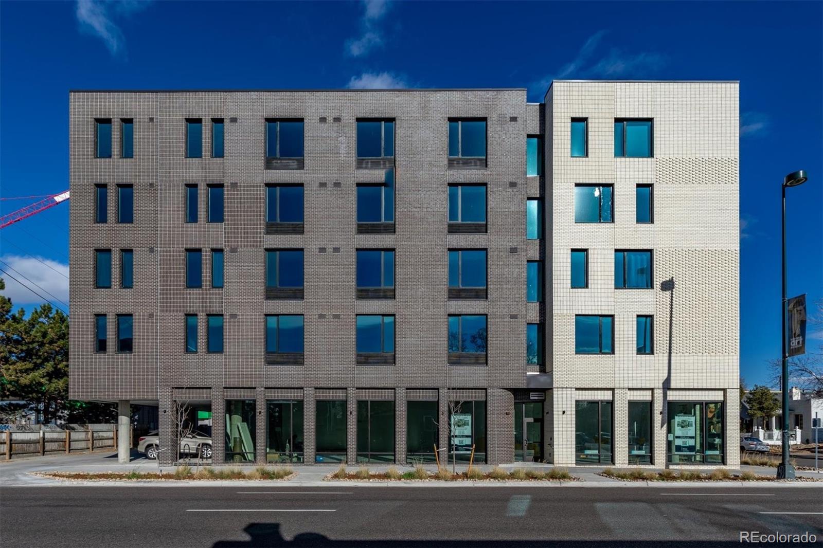 603 Inca Street, Unit 309 Denver, CO 80204 - Photo 6 of 27 a front view of a building with a street
