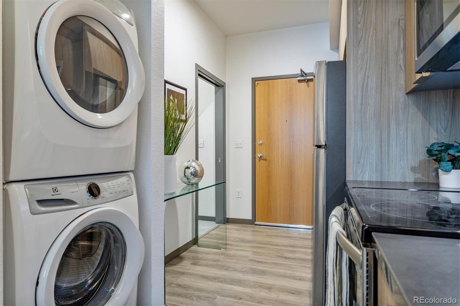 603 Inca Street, Unit 309 Denver, CO 80204 - Photo 9 of 27 a view of a hallway with washer and dryer