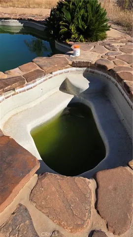 a view of a patio with table and chairs potted plants