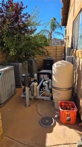 a view of roof deck with chairs and wooden fence