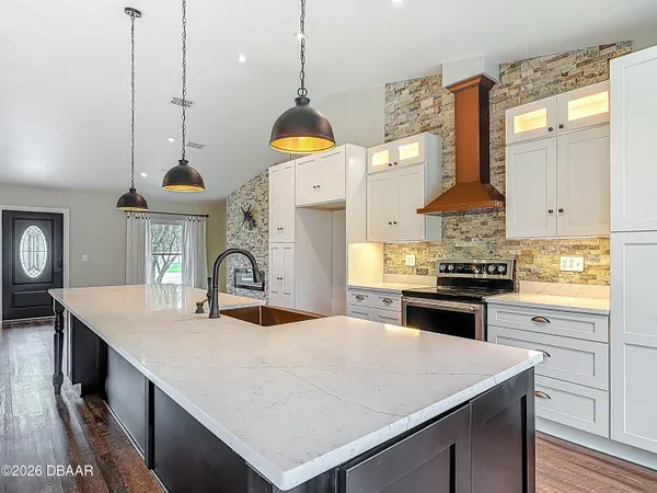 a kitchen with sink cabinets and window