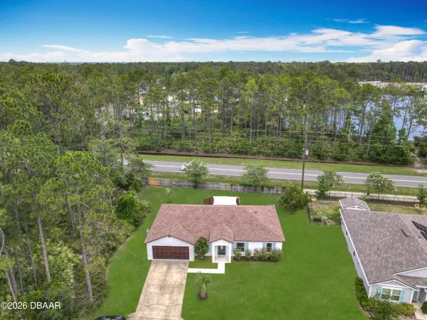 a view of a lake with a yard