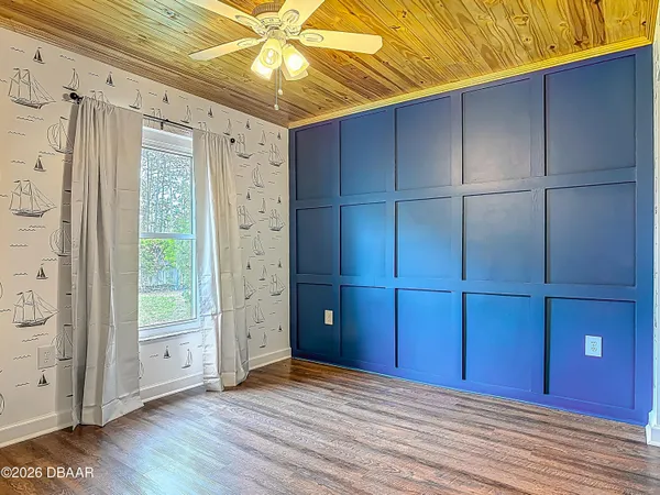 a view of front door with wooden floor