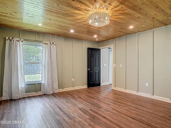 a view of a park with a large tree