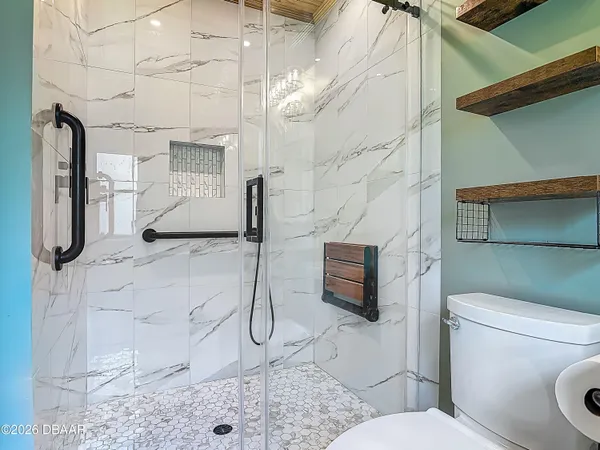 a aerial view of a house with a yard