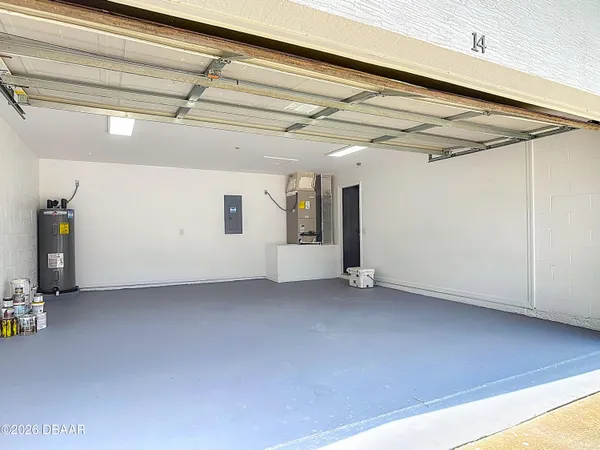 an aerial view of residential houses with outdoor space and city view