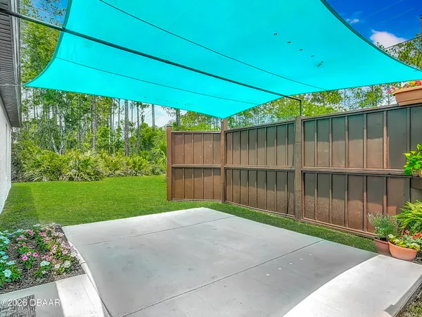 a view of a garden with an outdoor space