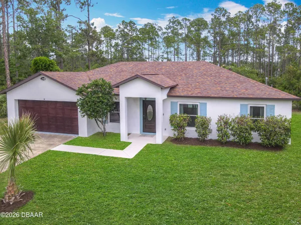 a view of a kitchen with refrigerator stove and wooden floor