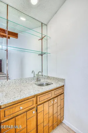 a view of living room with granite countertop furniture and fireplace