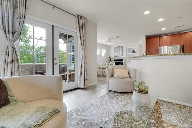 a living room with furniture and windows
