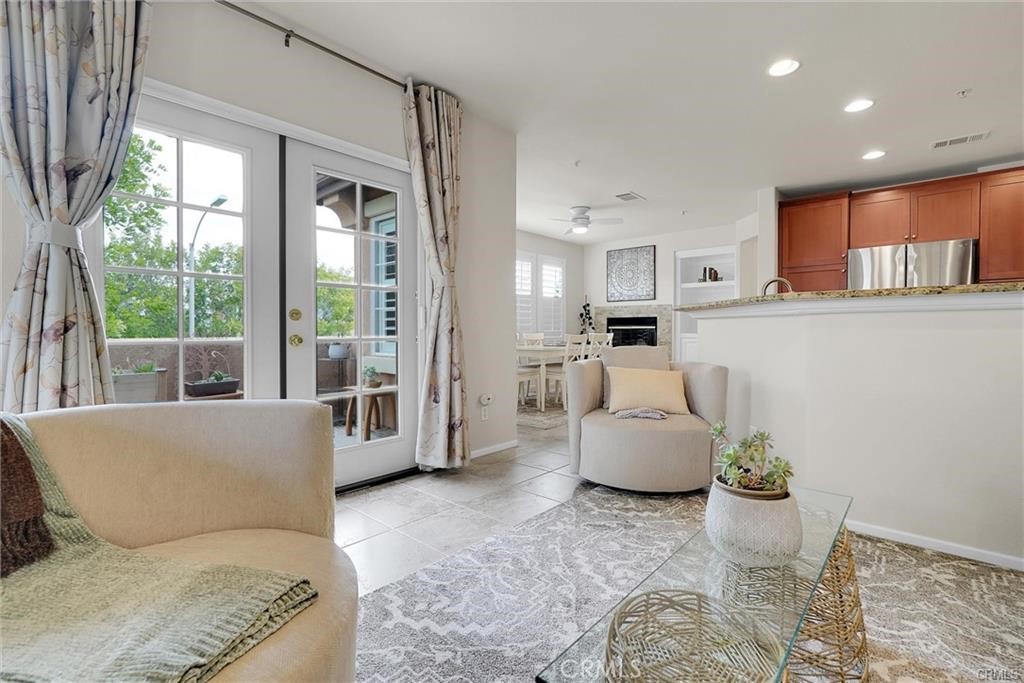 33631 Winston Way Temecula, CA 92592 - Photo 11 of 29 a living room with furniture and windows