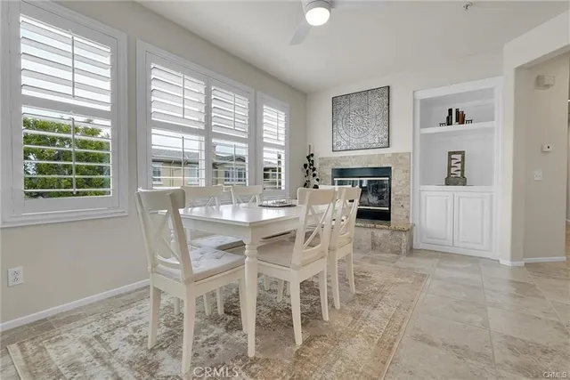 a dining room with furniture and window