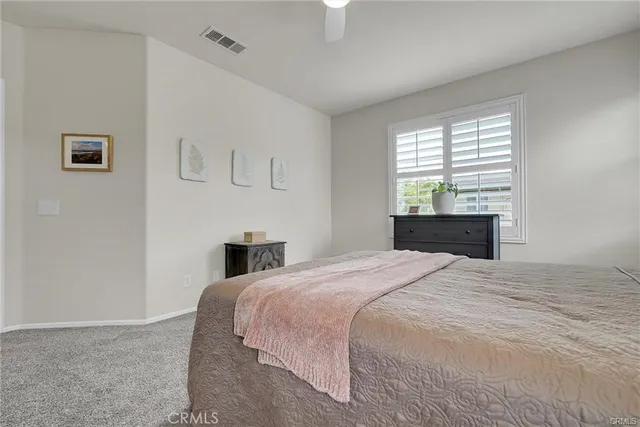 a bed room with a bed and a fireplace