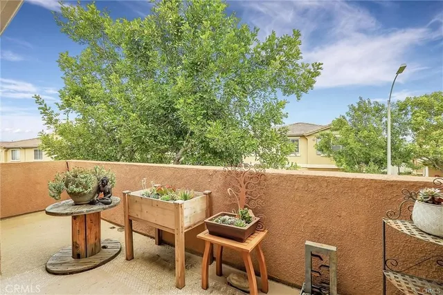 a view of a chairs and table in a backyard