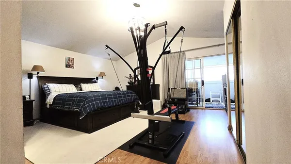 a bedroom with a bed and a mirror