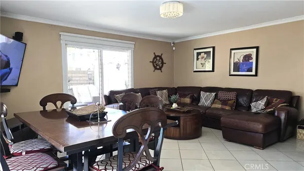 a view of a dining room with furniture and a window