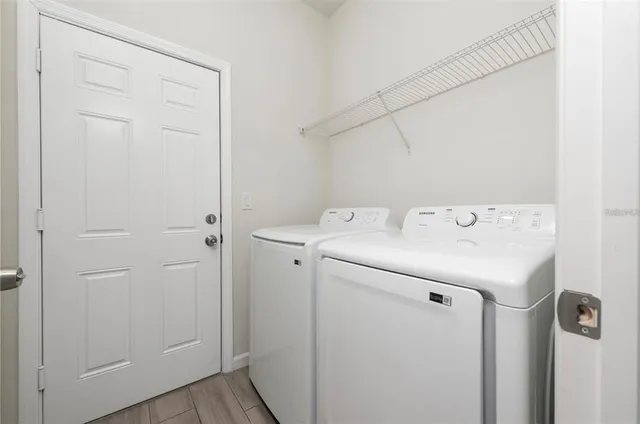 a utility room with dryer and washer