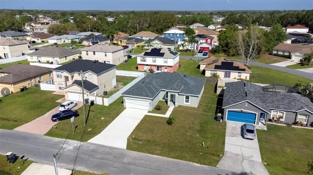 an aerial view of a house with a garden