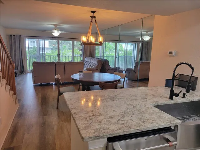 a kitchen with a table and chairs