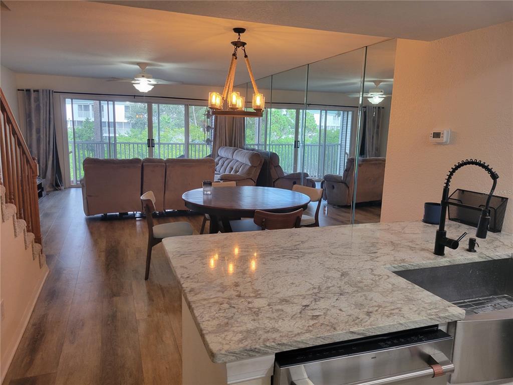 9976 Indian Key Trail, Unit 7 Seminole, FL 33776 - Photo 4 of 15 a kitchen with a table and chairs