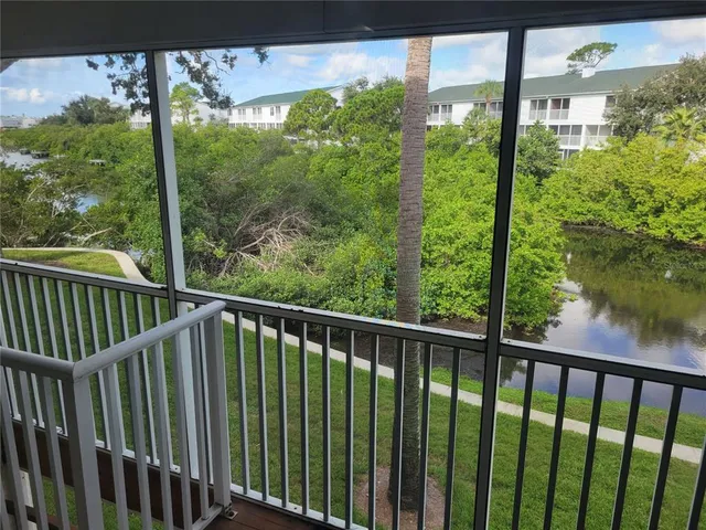 a view of a balcony with lake view