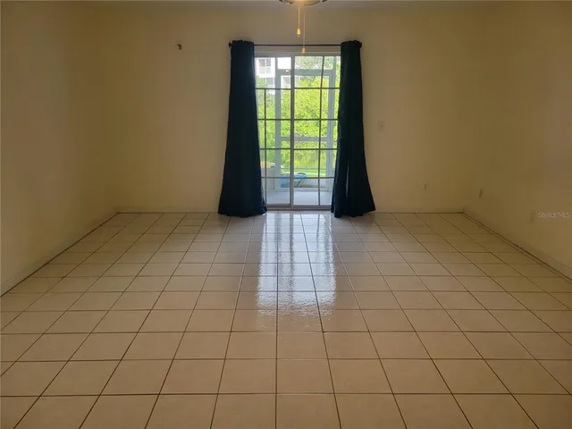 a view of an empty room and window