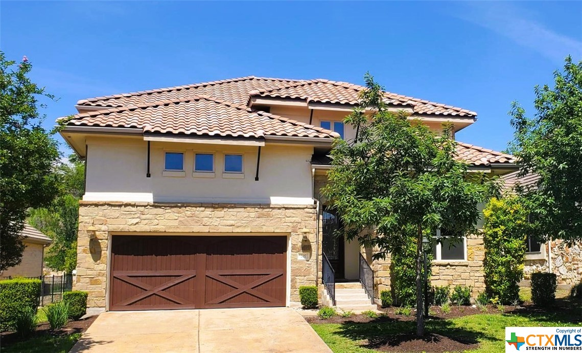 a view of a house with a potted plant