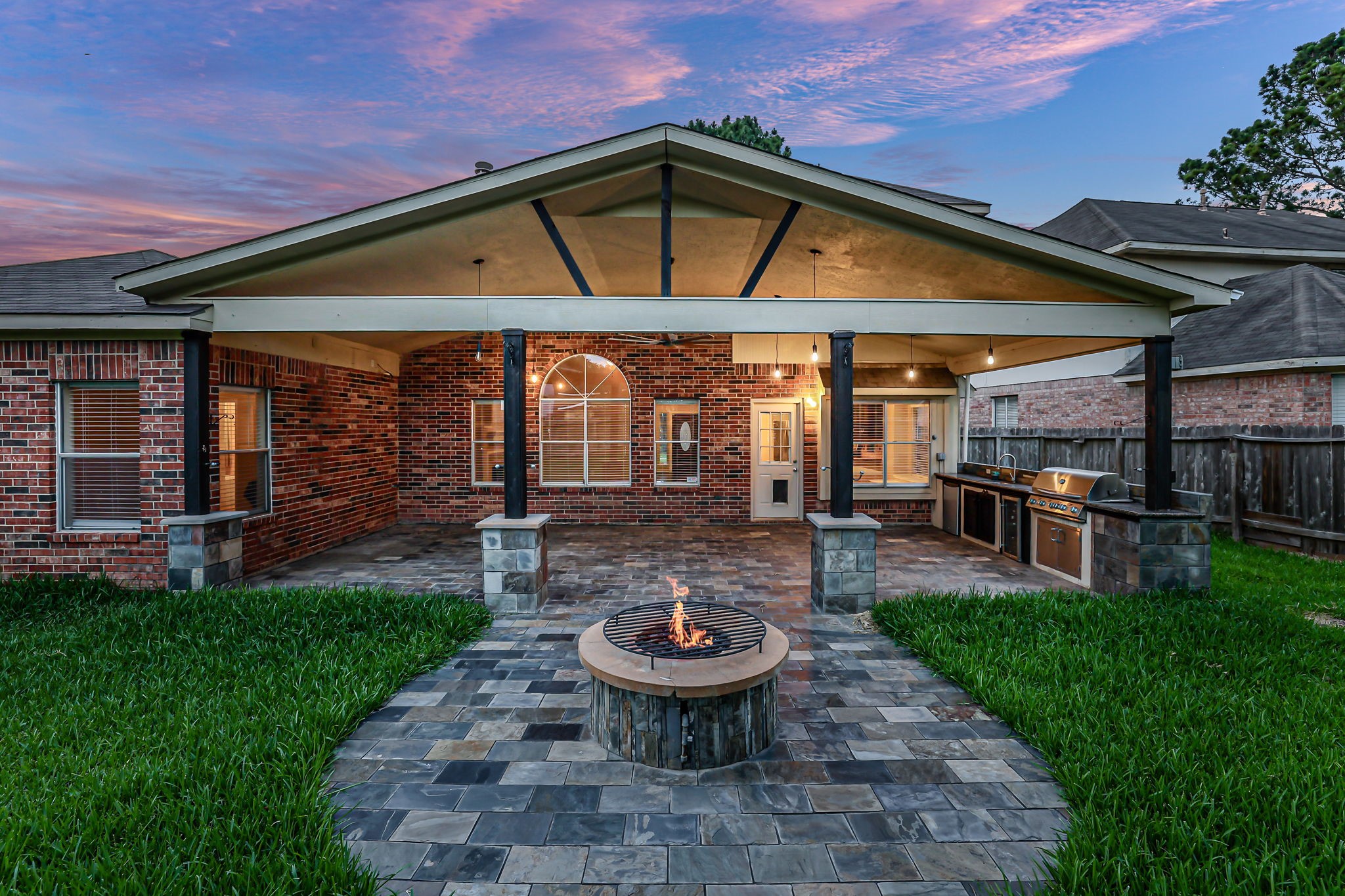23207 Olive Ridge Court Katy, TX 77494 - Photo 45 of 46 a view of a backyard with table and chairs under an umbrella