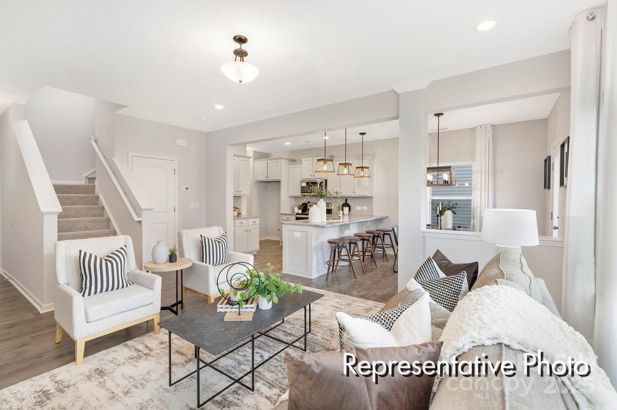 12540 Gotland Road, Unit 329 Midland, NC 28107 - Photo 7 of 22 a living room with furniture and wooden floor