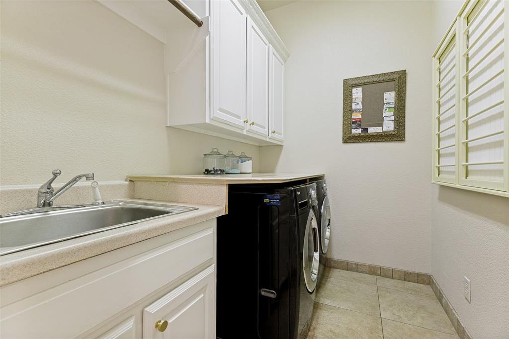 229 Arbor Lane Haslet, TX 76052 - Photo 19 of 34 Utility room featuring a built-in sink with a countertop, white cabinetry with gold-tone hardware, and tile flooring