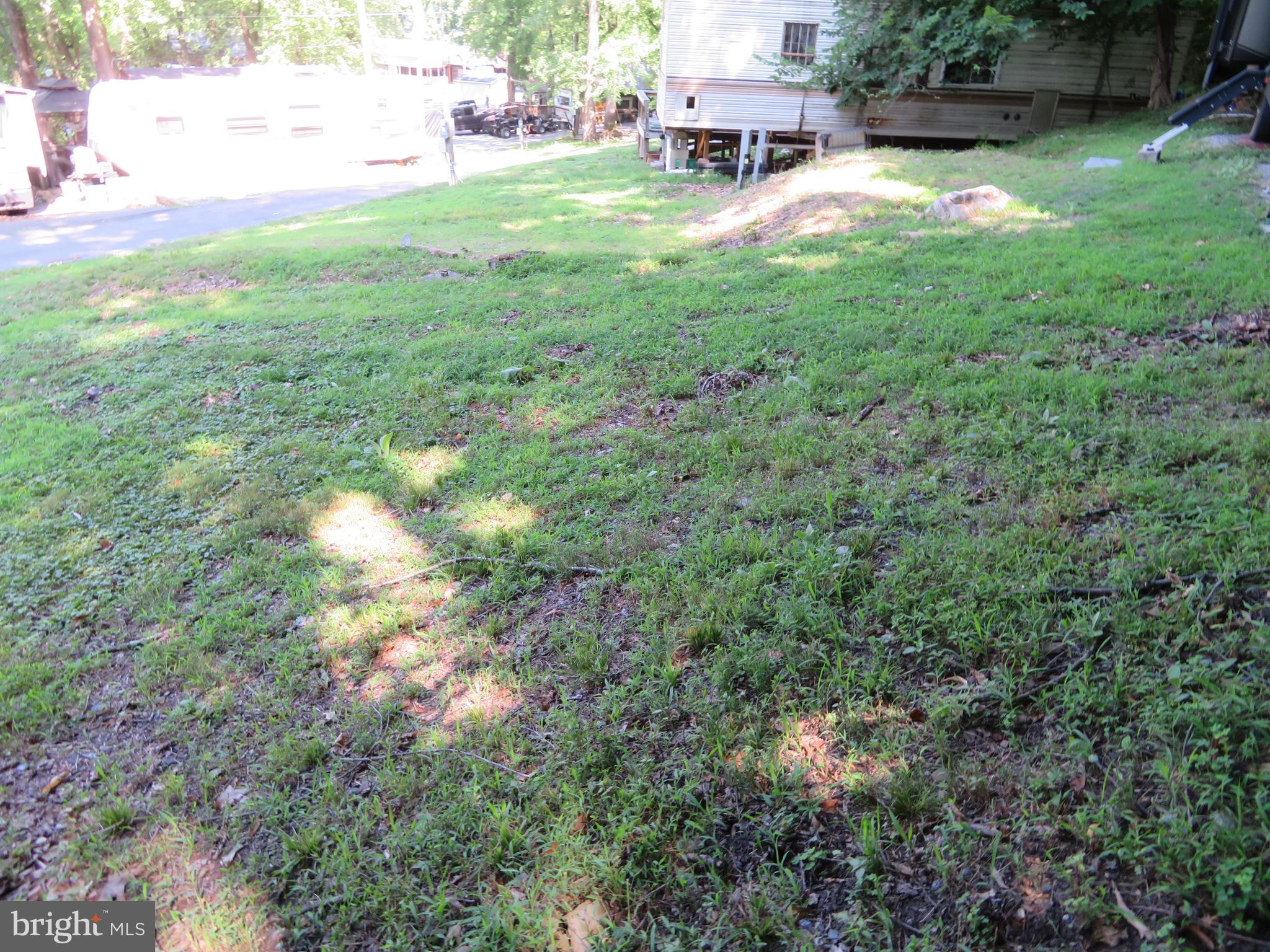 14 Detour Road Falling Waters, WV 25419 - Photo 3 of 31 a backyard of a house with table and chairs