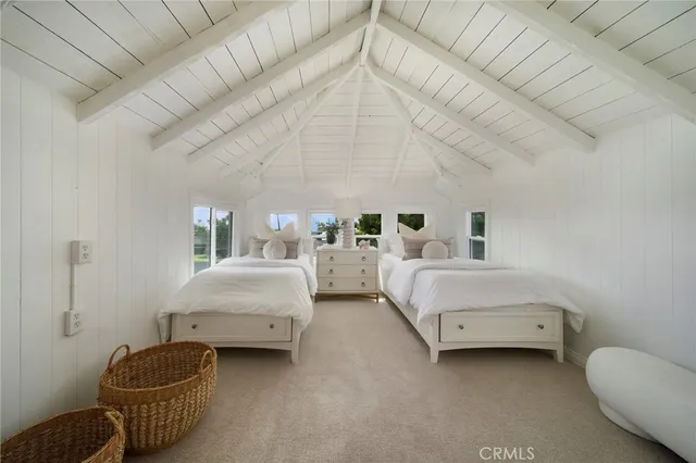 a bedroom with bed and window