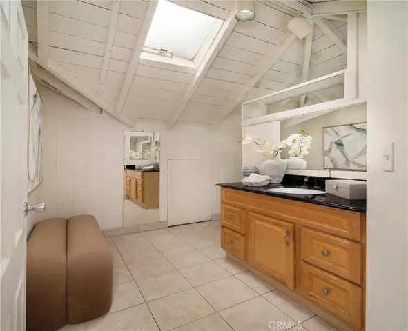 a room with granite countertop furniture and a painting on the wall