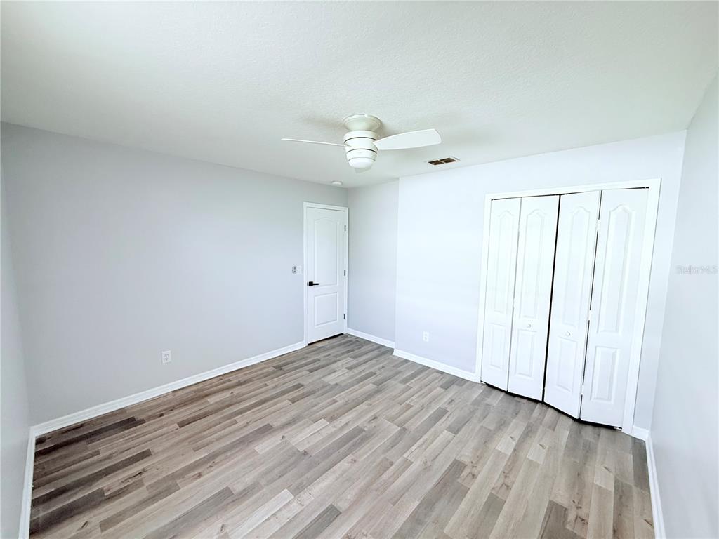 465 Haversham Road Deltona, FL 32725 - Photo 12 of 20 wooden floor in an empty room