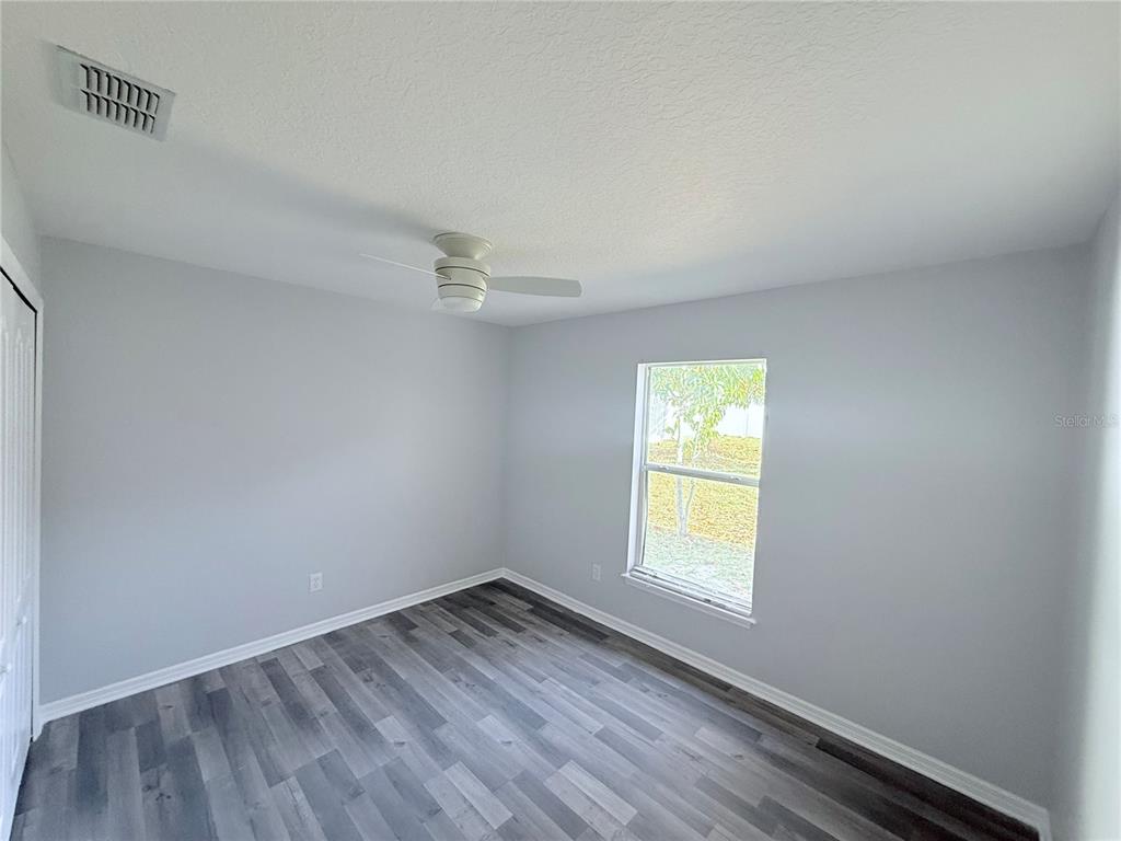 465 Haversham Road Deltona, FL 32725 - Photo 13 of 20 a view of empty room with window