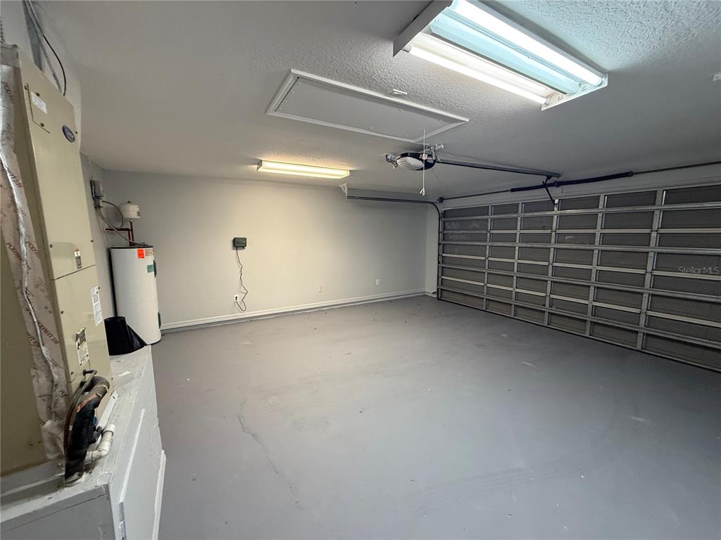 465 Haversham Road Deltona, FL 32725 - Photo 8 of 20 a view of an empty room with a garage