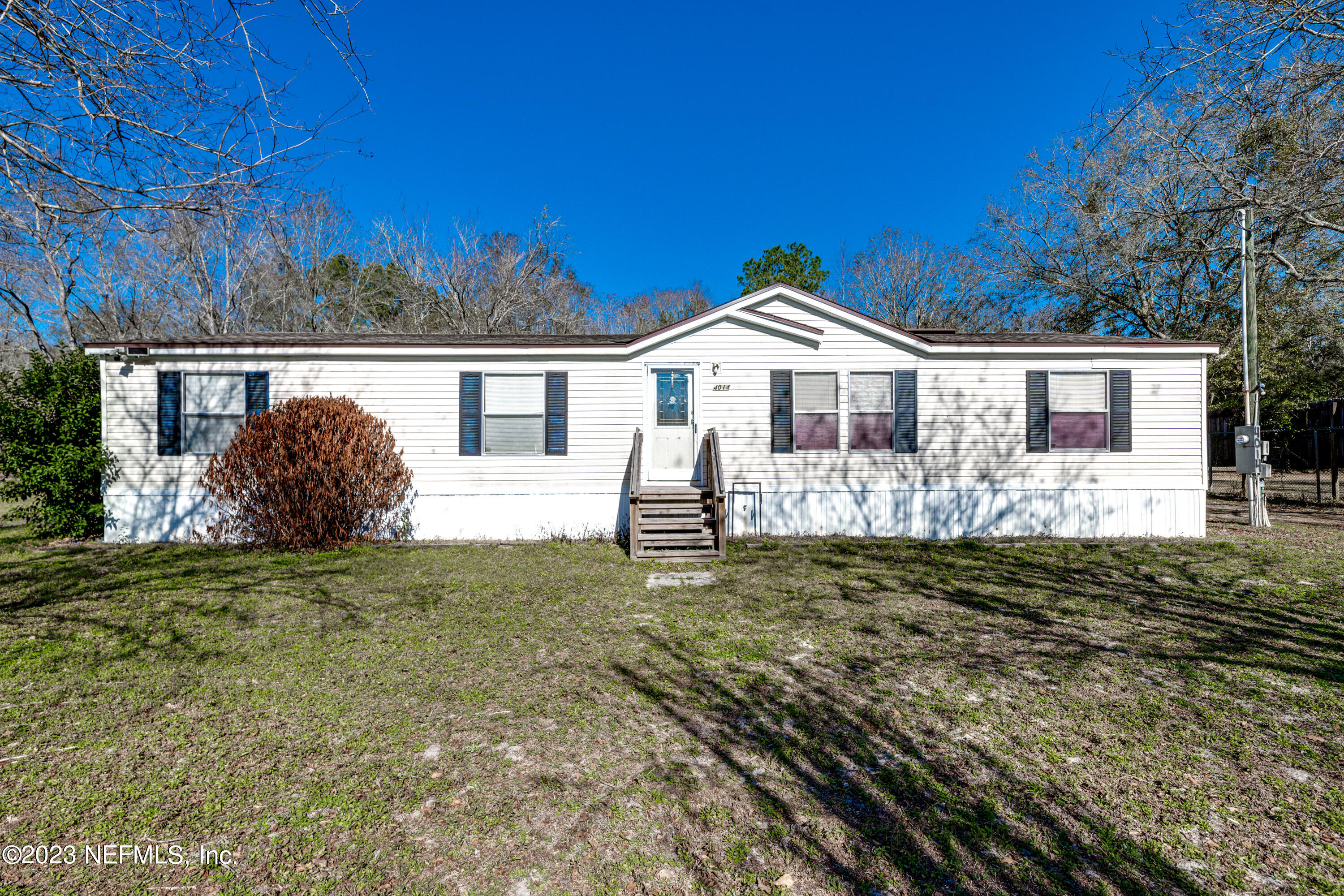 4014 Pinto Road Middleburg, FL 32068 - Photo 1 of 19 a house with green field in front of it