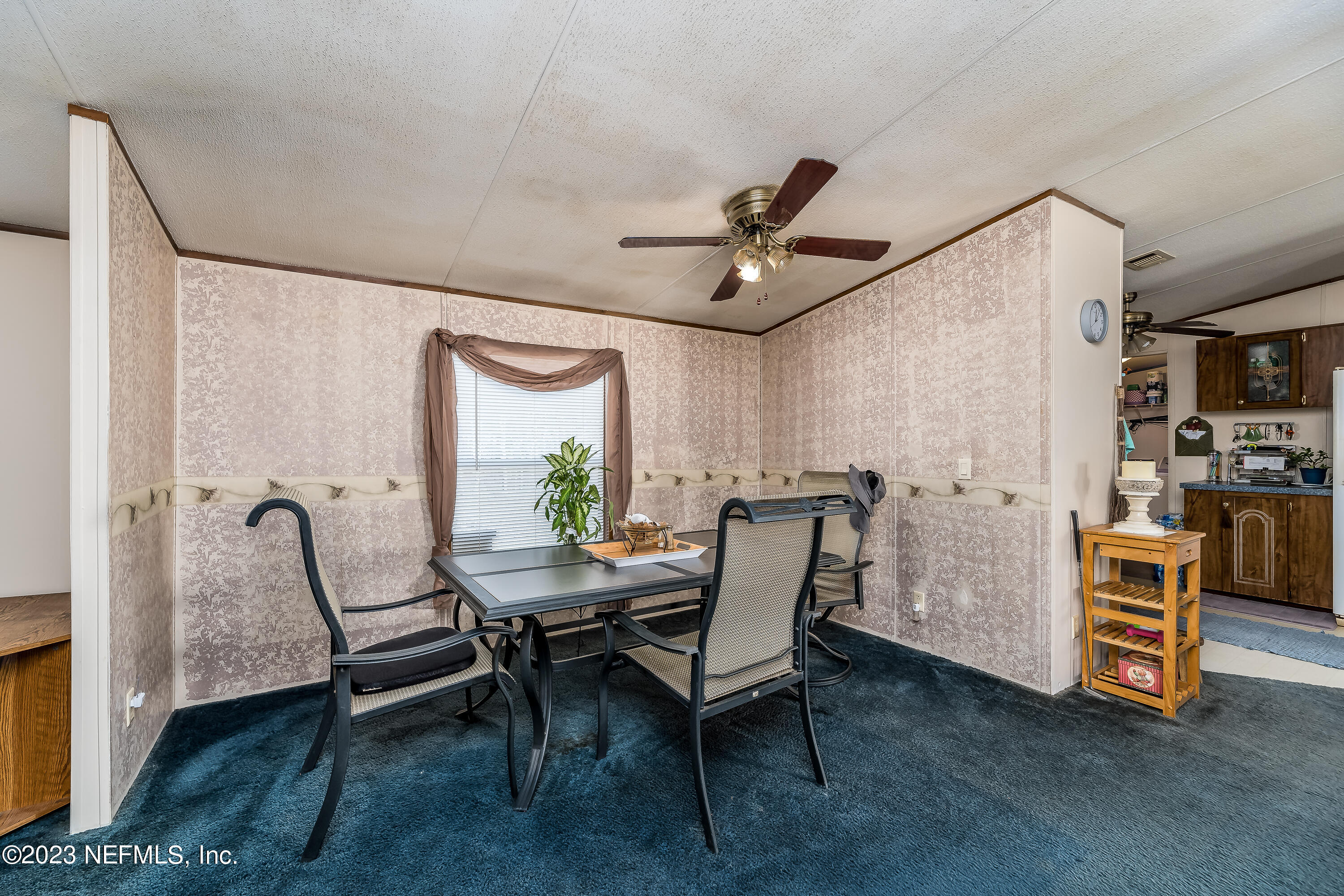 4014 Pinto Road Middleburg, FL 32068 - Photo 12 of 19 a view of a dining room with furniture and a window