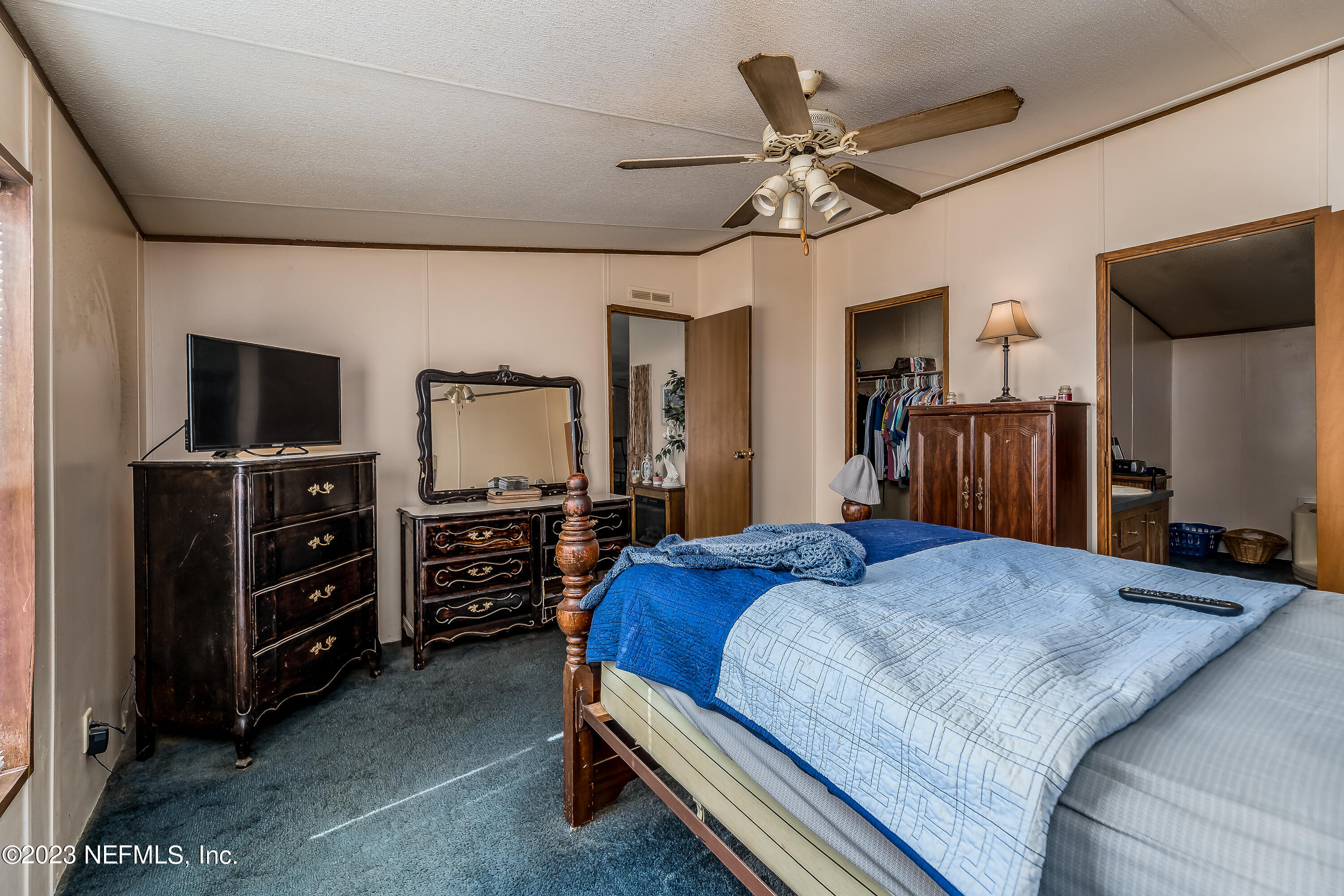 4014 Pinto Road Middleburg, FL 32068 - Photo 18 of 19 a bed room with a bed and a television
