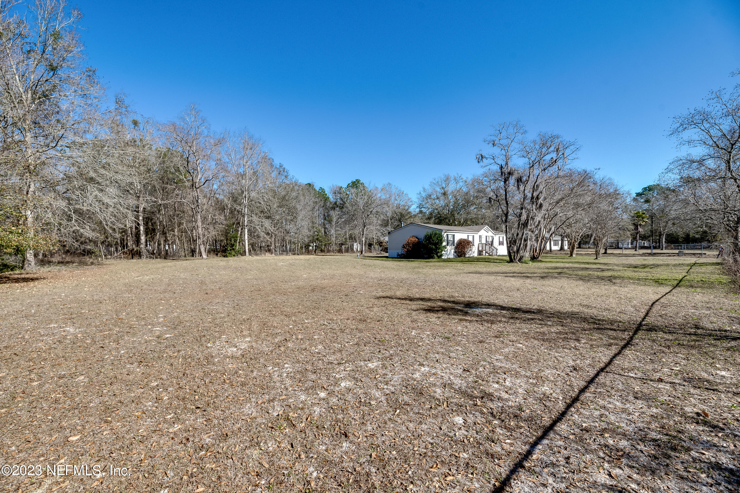 4014 Pinto Road Middleburg, FL 32068 - Photo 3 of 19 a view of dirt field with trees in background