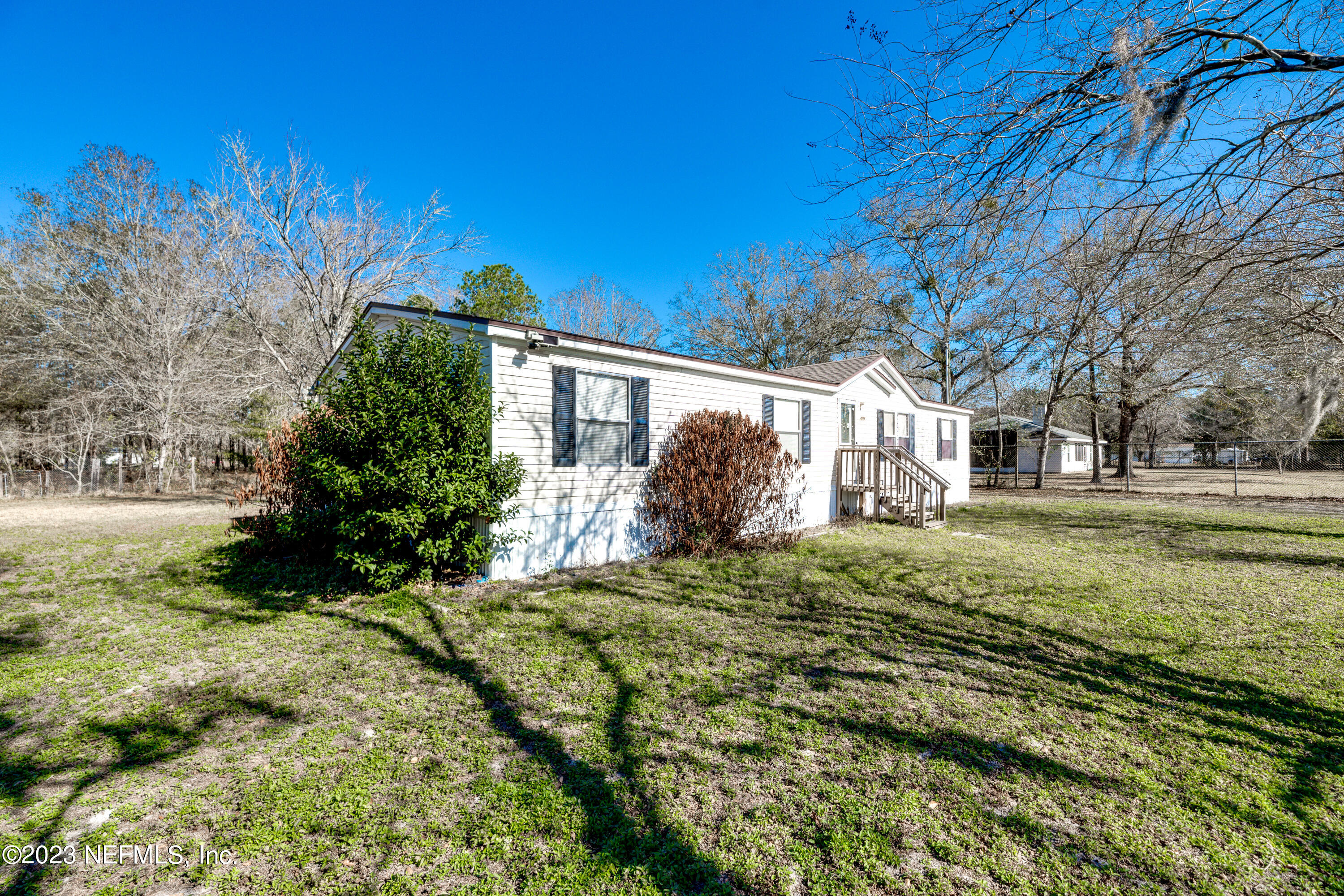 4014 Pinto Road Middleburg, FL 32068 - Photo 4 of 19 a view of a house with a yard