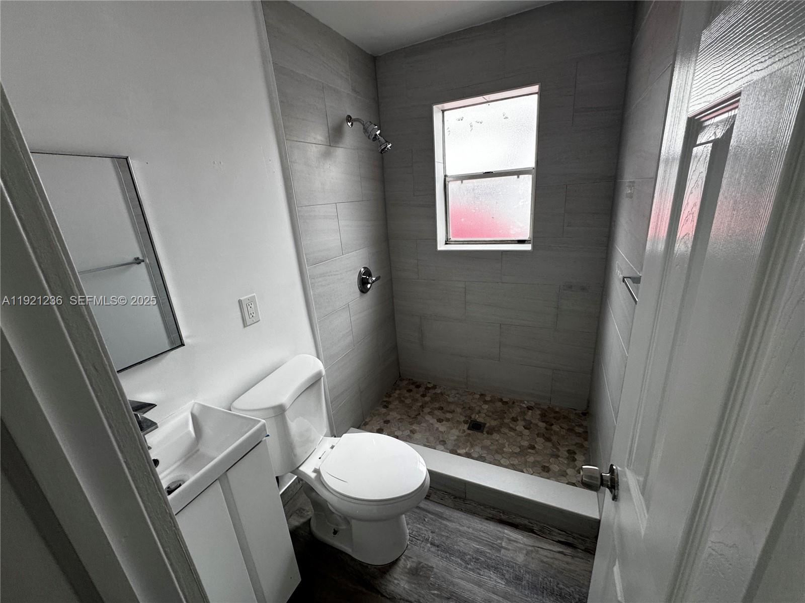 2034 Taylor Street Hollywood, FL 33020 - Photo 13 of 35 a bathroom with a toilet and a shower