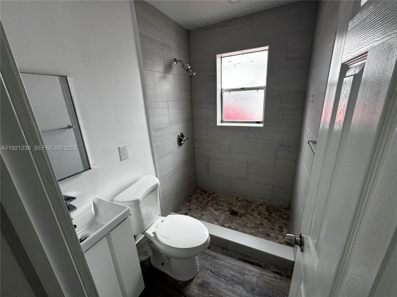 2034 Taylor Street Hollywood, FL 33020 - Photo 22 of 35 a bathroom with a toilet and a shower