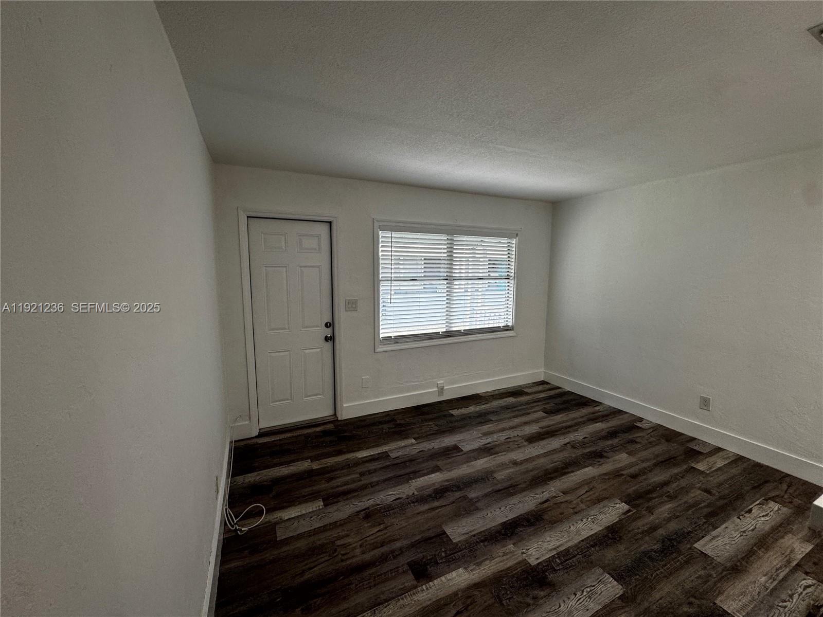 2034 Taylor Street Hollywood, FL 33020 - Photo 26 of 35 a view of a room with wooden floor and a window