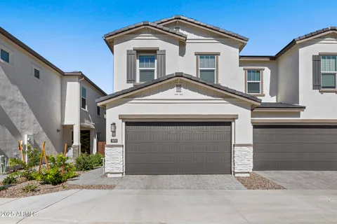 a front view of a house with garage