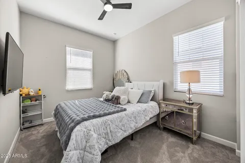 a bedroom with a bed and a book shelf