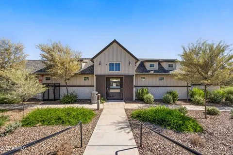 a view of a lake with couches chairs