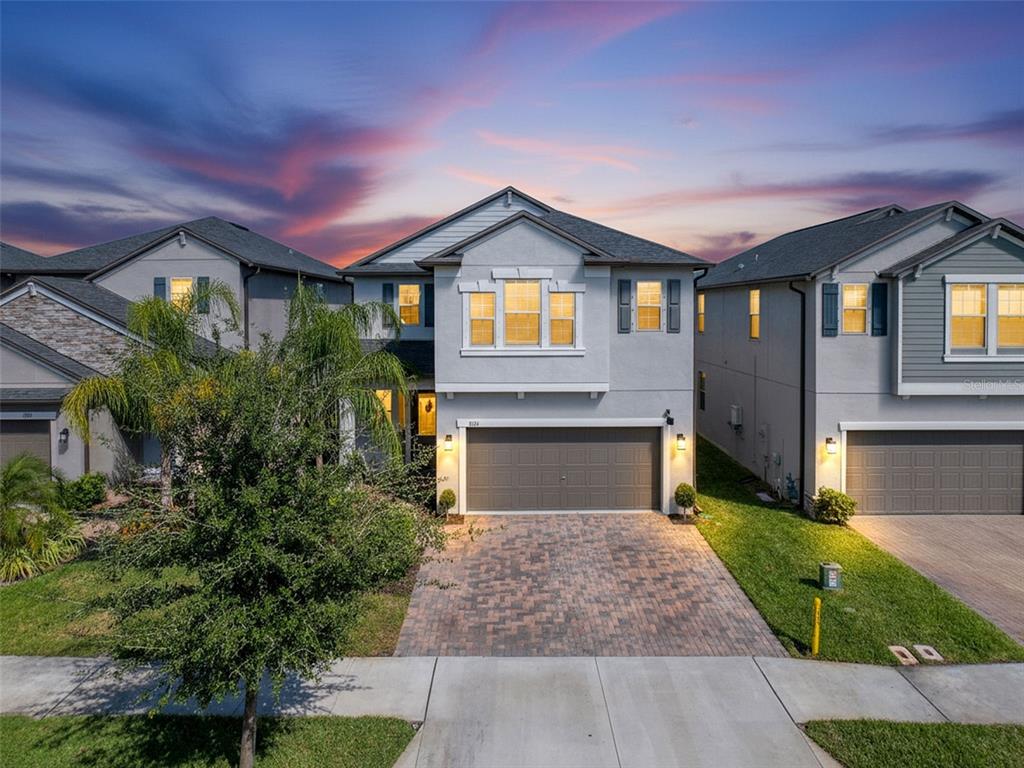 8124 Olympic Stone Circle Trinity, FL 34655 - Photo 2 of 75 a front view of house with yard