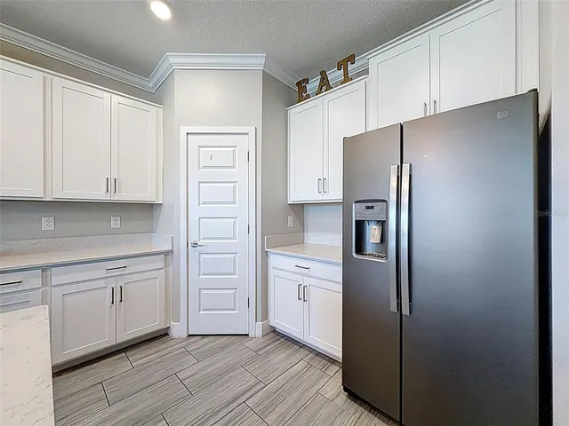 a outdoor space with patio the couches and a dining table with the view of the house